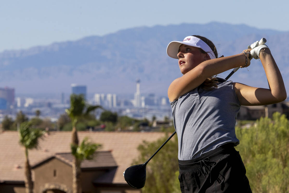 Faith Lutheran’s Scarlett Schneider drives her ball during the 5A Desert League girls go ...