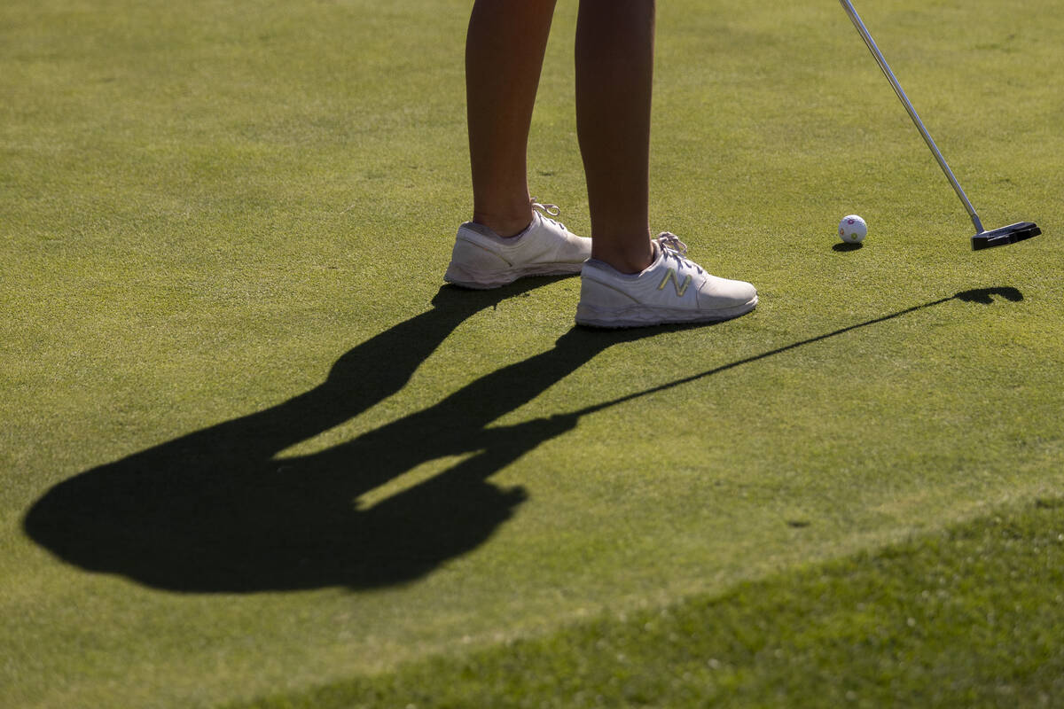 Faith Lutheran’s Scarlett Schneider prepares to putt the ball during the 5A Desert Leagu ...