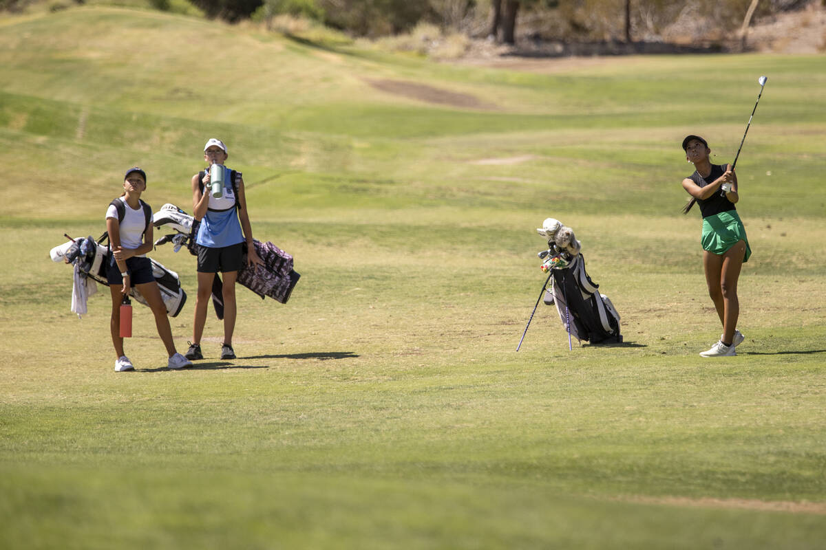 Coronado’s Alexa Hart, left, and Centennial’s Riley Simmons, center, watches Palo ...