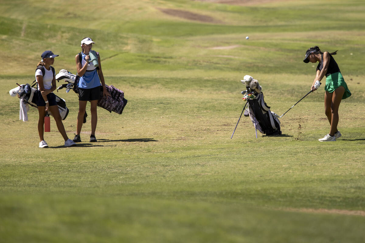 Coronado’s Alexa Hart, left, and Centennial’s Riley Simmons, center, watches Palo ...