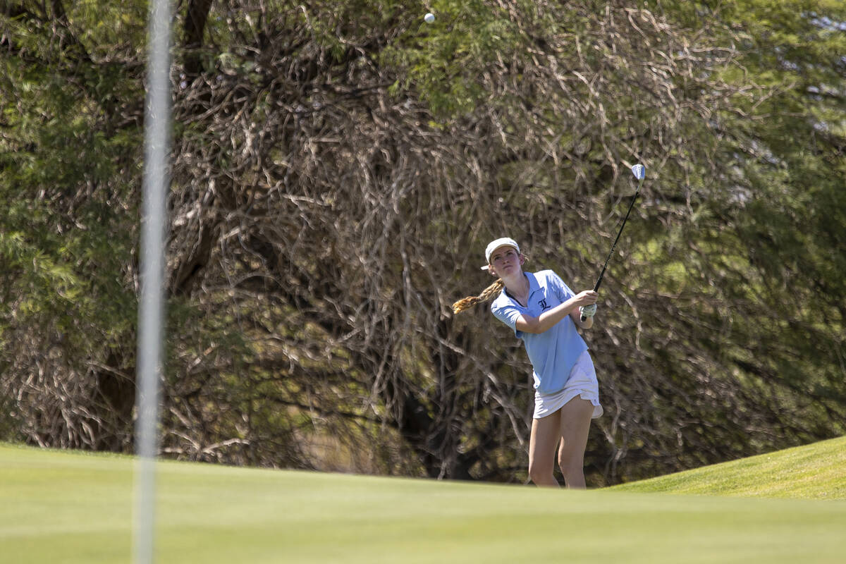 Liberty’s Mikayla Weinberger chips her ball toward the green during the 5A Desert League ...