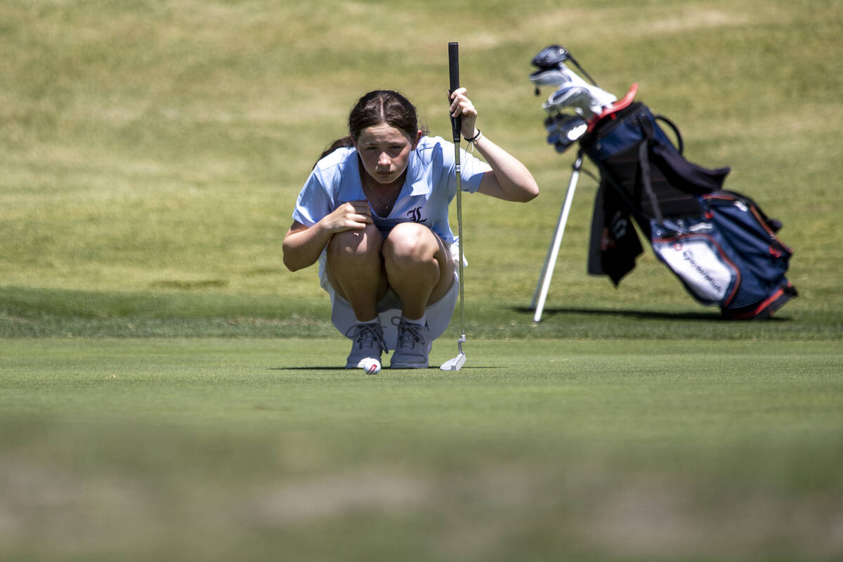 Liberty’s Claire Ackerman lines up her putt during the 5A Desert League girls golf match ...