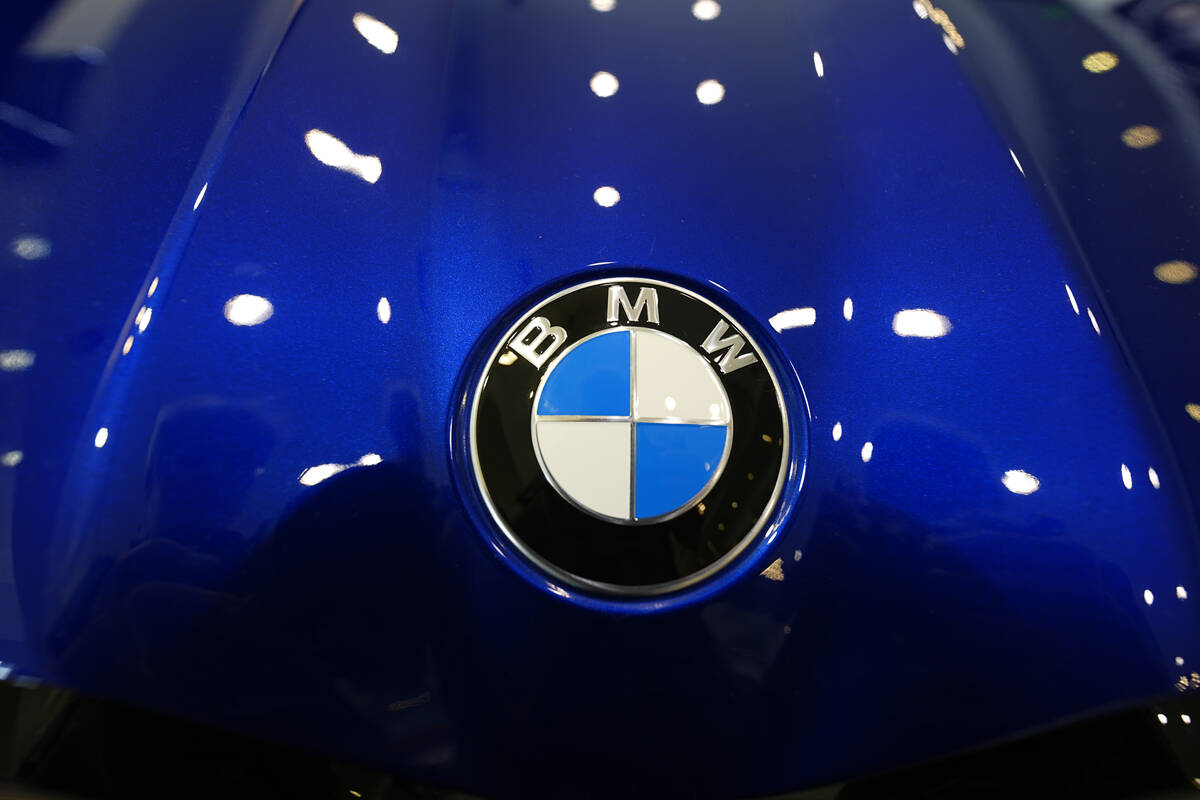 The company logo shines on the hood of an unsold vehicle at a Mini Honda BMW dealership on July ...