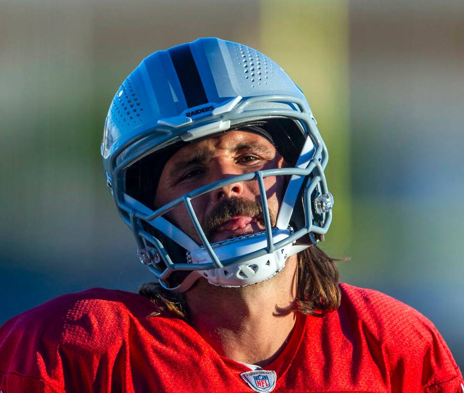 Raiders quarterback Gardner Minshew (15) sticks his tongue out during practice at the Intermoun ...