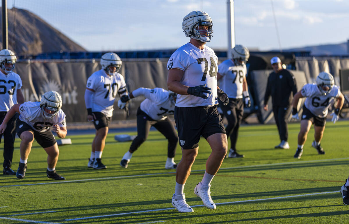 Raiders offensive tackle Kolton Miller (74) runs a drill with teammates during practice at the ...