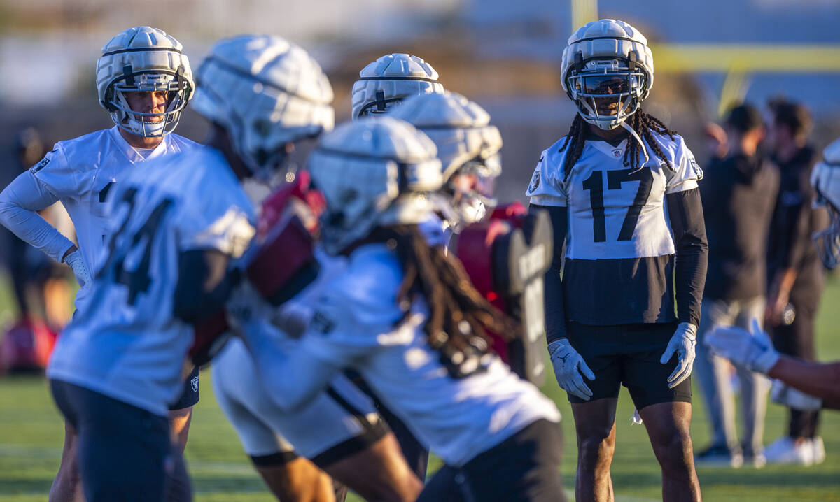 Raiders wide receiver Davante Adams (17) watches teammates on a drill during practice at the In ...