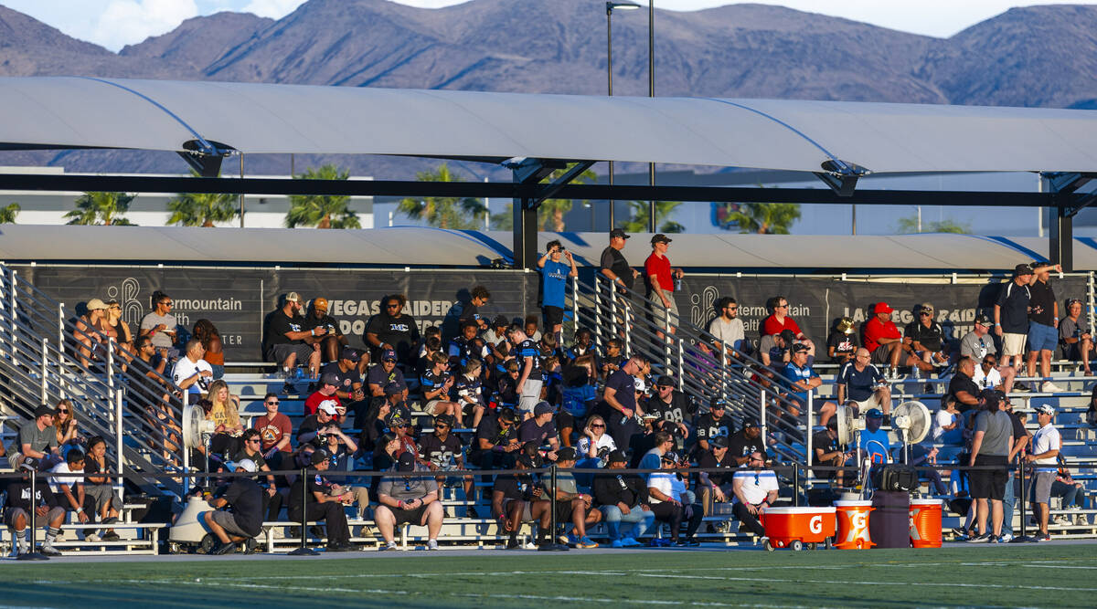 Raiders alumni and their families watch practice at the Intermountain Health Performance Center ...