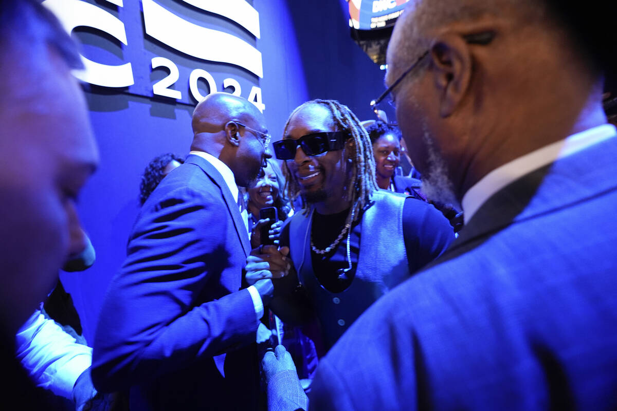 Lil Jon shakes hand with Sen. Raphael G. Warnock, D-Ga., left, as he joins the Georgia delegati ...