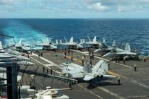 In this photograph released by the U.S. Navy, the flight deck of the Nimitz-class aircraft carr ...