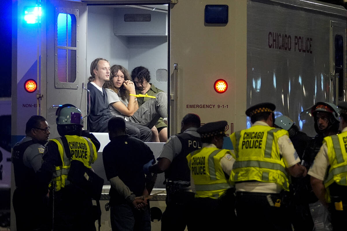 Demonstrators are taken into custody by police near the Israeli Consulate during the Democratic ...