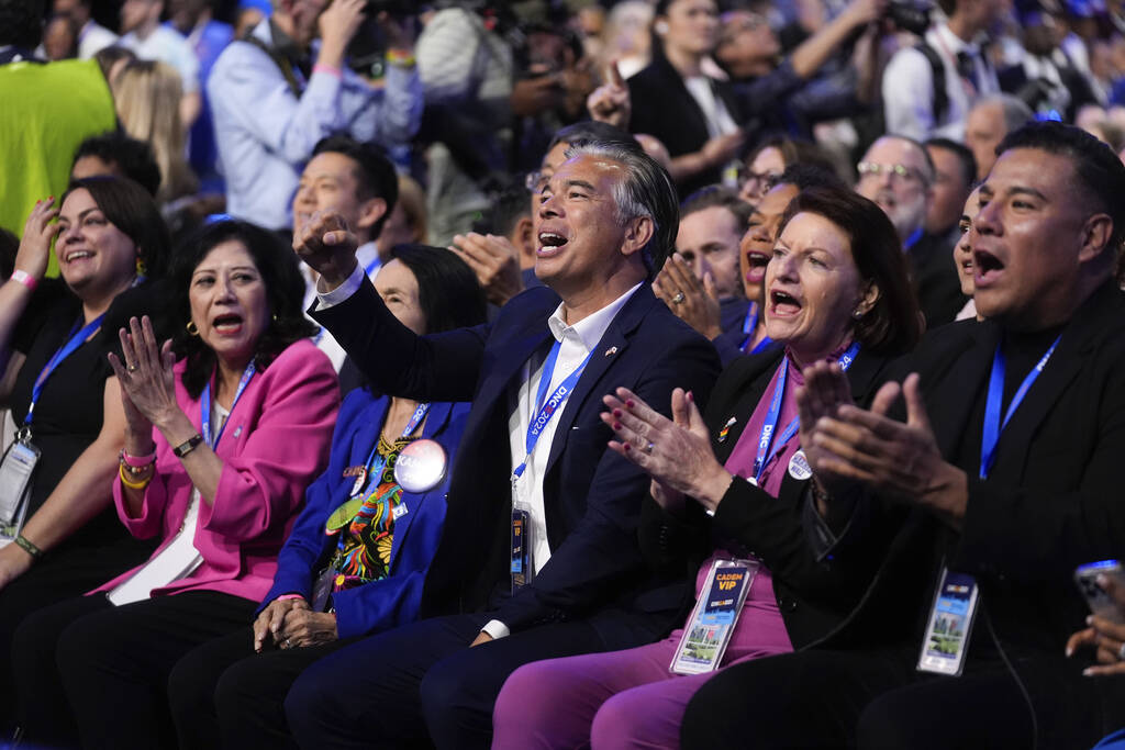 Delegates cheer during the Democratic National Convention Wednesday, Aug. 21, 2024, in Chicago. ...