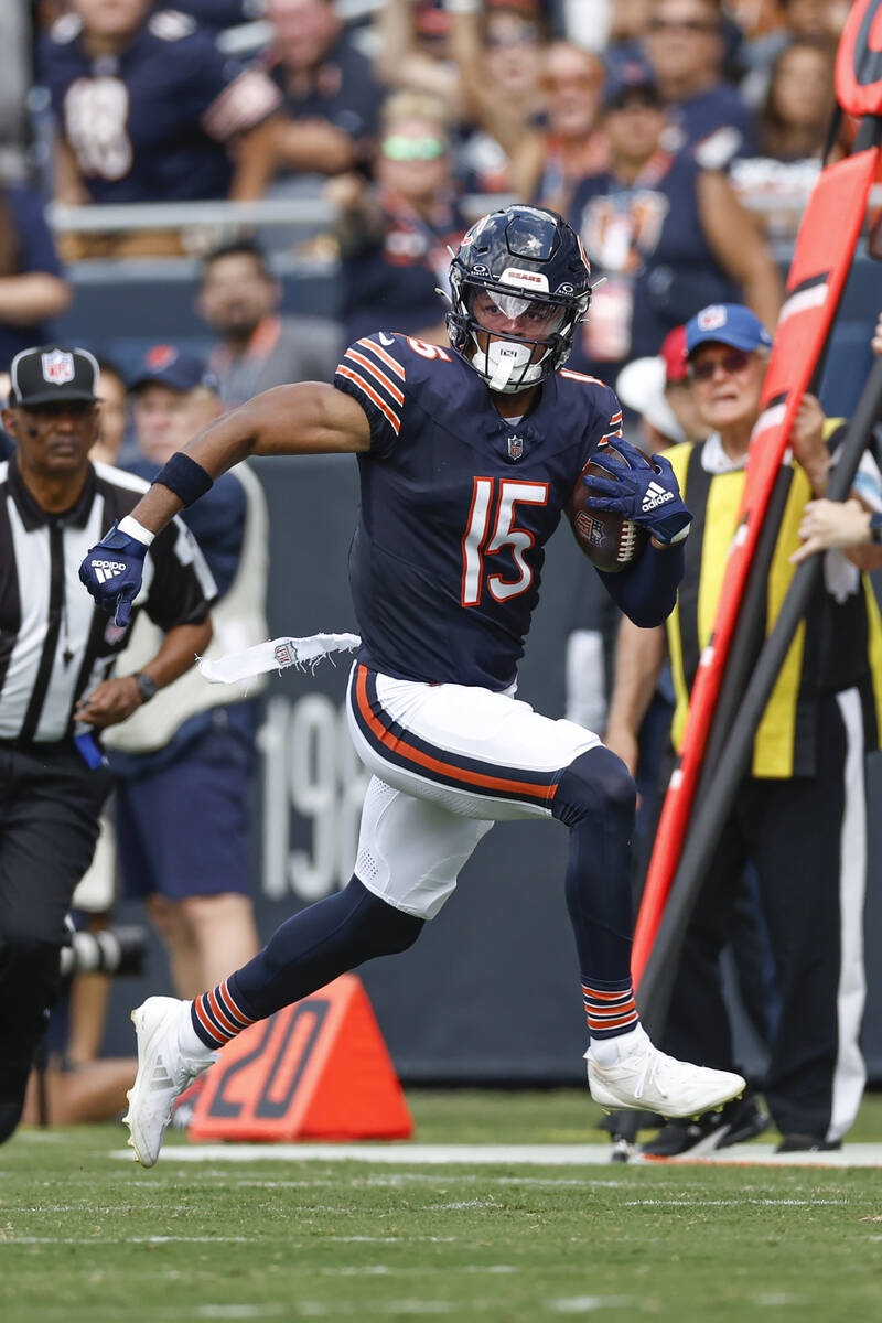 Chicago Bears wide receiver Rome Odunze (15) runs with the ball during the first half of an NFL ...