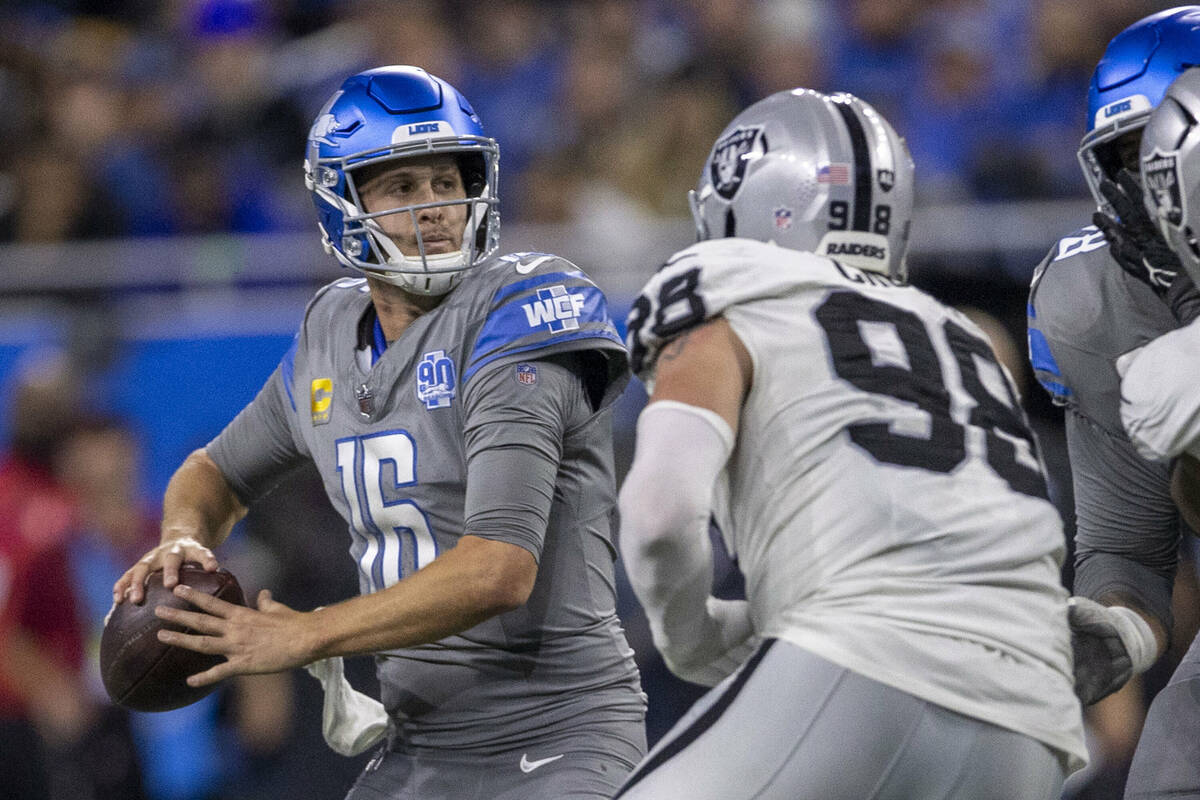 Raiders defensive end Maxx Crosby (98) pressures Detroit Lions quarterback Jared Goff (16) duri ...