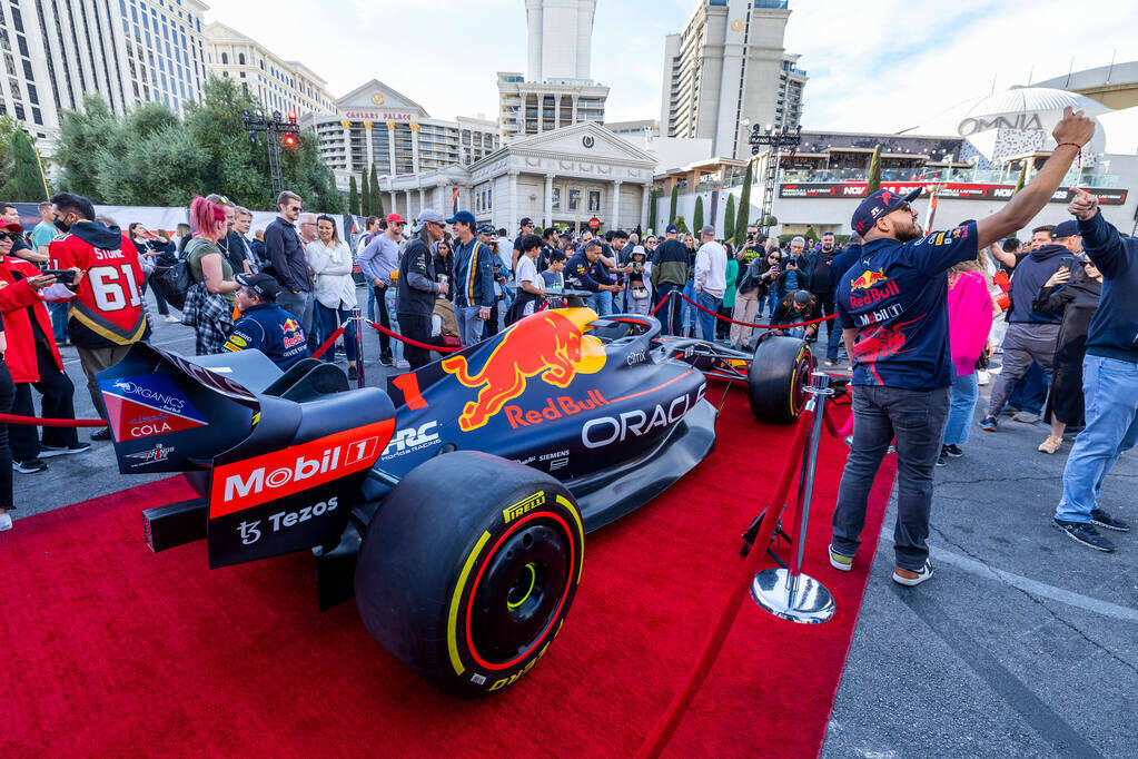 Fans check out a Red Bull race car during the Formula One Las Vegas Grand Prix Fan Fest at Caes ...