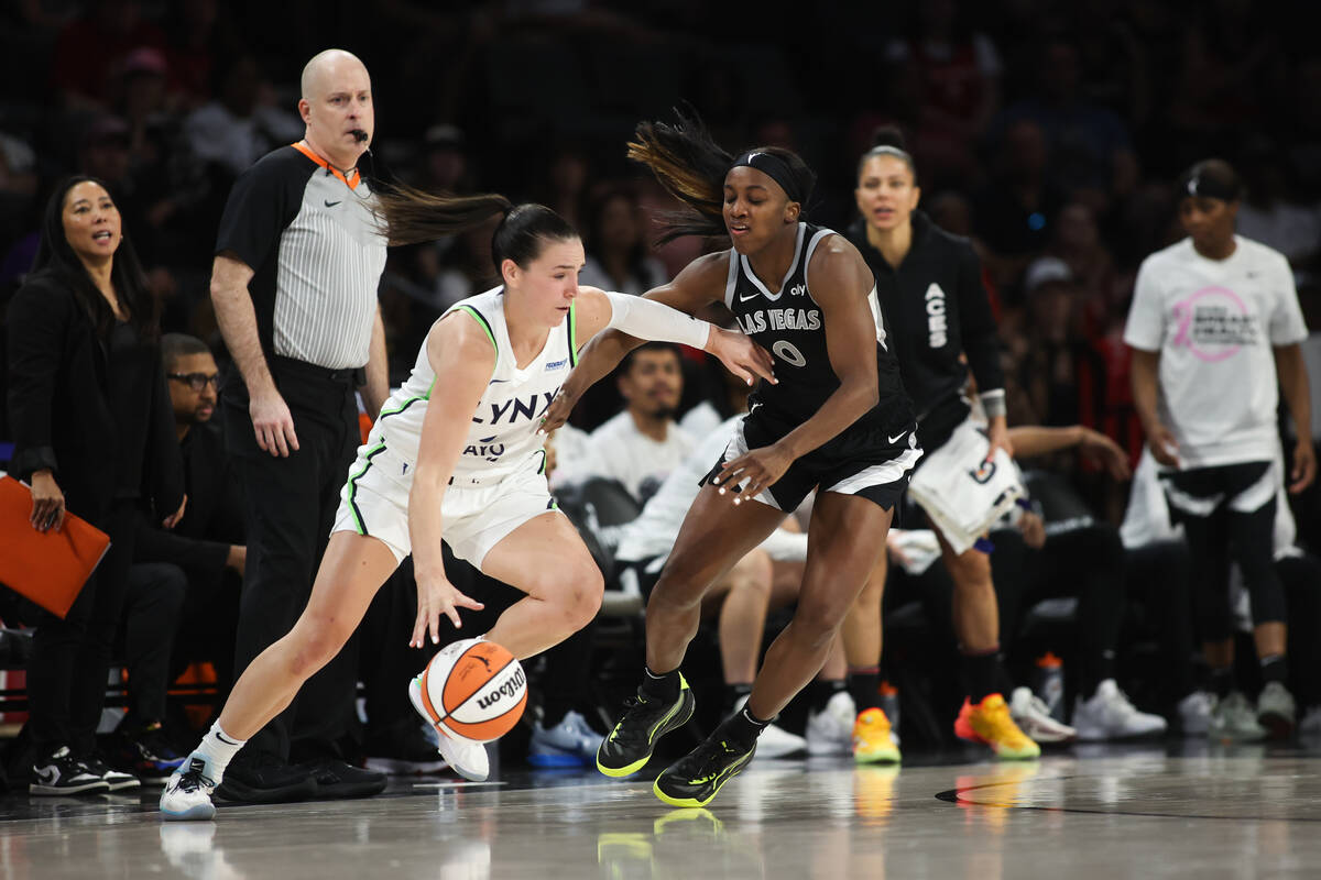 Minnesota Lynx forward Bridget Carleton (6) dribbles against Las Vegas Aces guard Jackie Young ...