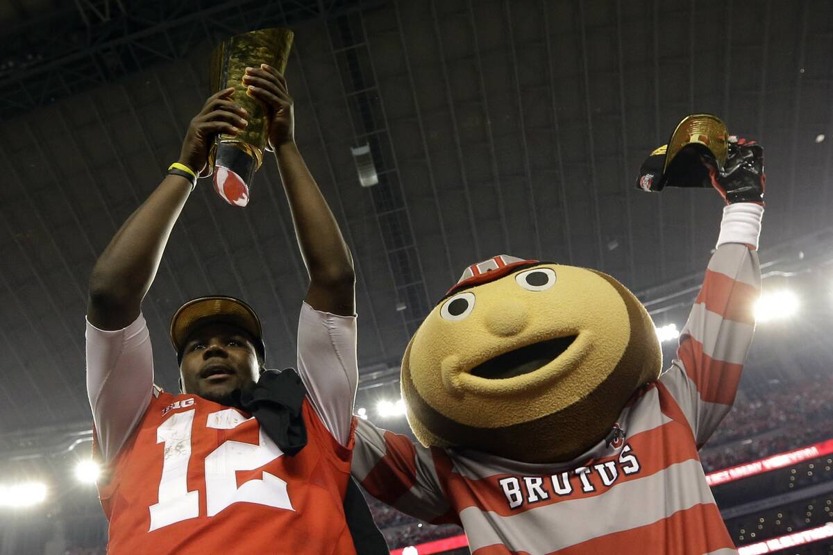 Ohio State's Cardale Jones and their mascot celebrate after the NCAA college football playoff c ...