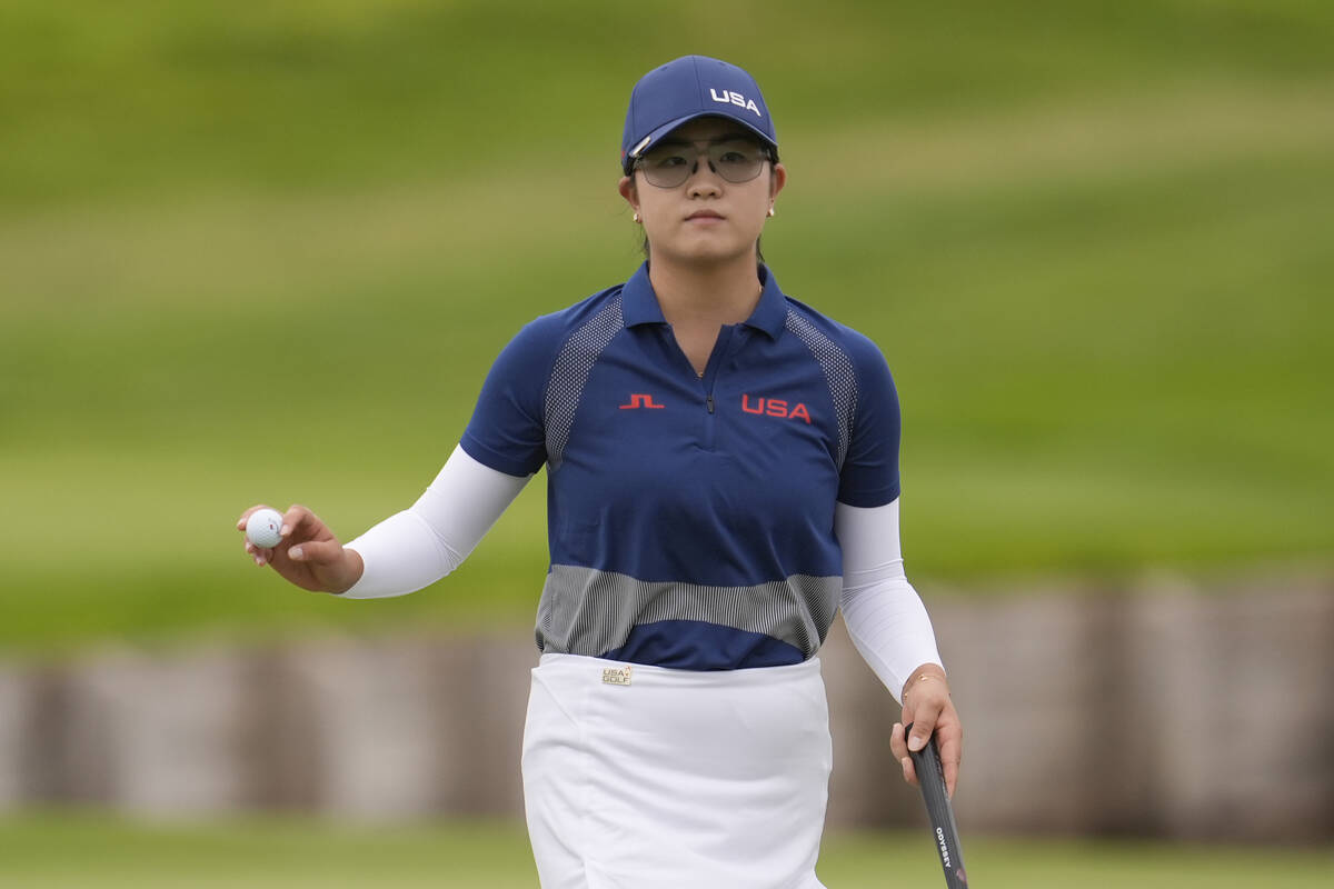 Rose Zhang, of the United States, acknowledges the crowd after putting on the 2nd green during ...