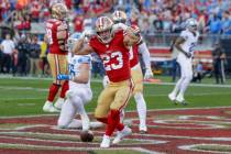 San Francisco 49ers' running back Christian McCaffrey (23) reacts after scoring a touchdown aga ...