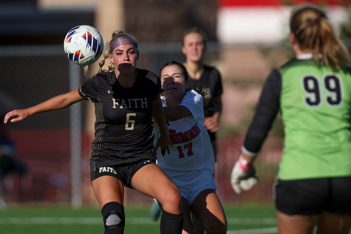 Faith Lutheran’s Jacey Phillips (6) thwarts an attempted goal by Bishop Gorman’s ...