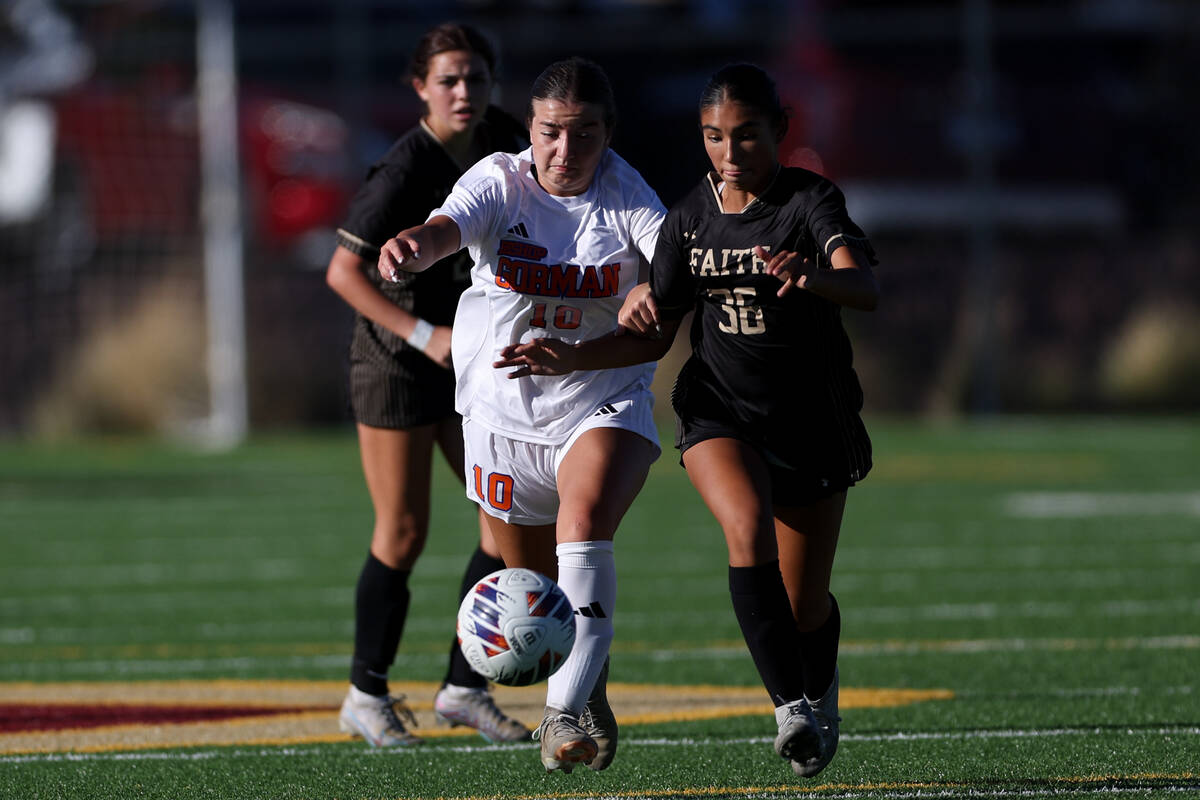 Bishop Gorman’s Stephenie Hackett (10) dribbles against Faith Lutheran’s Presley ...