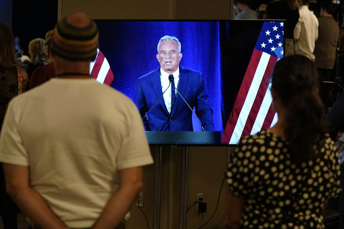 People watch on a monitor as Independent presidential candidate Robert F. Kennedy Jr. announces ...