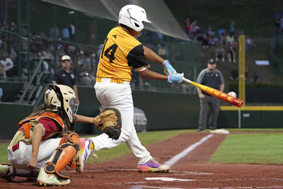 Lake Mary, Fla.'s James Feliciano (14) hits a solo home run off Henderson, Nev.'s Russell McGee ...