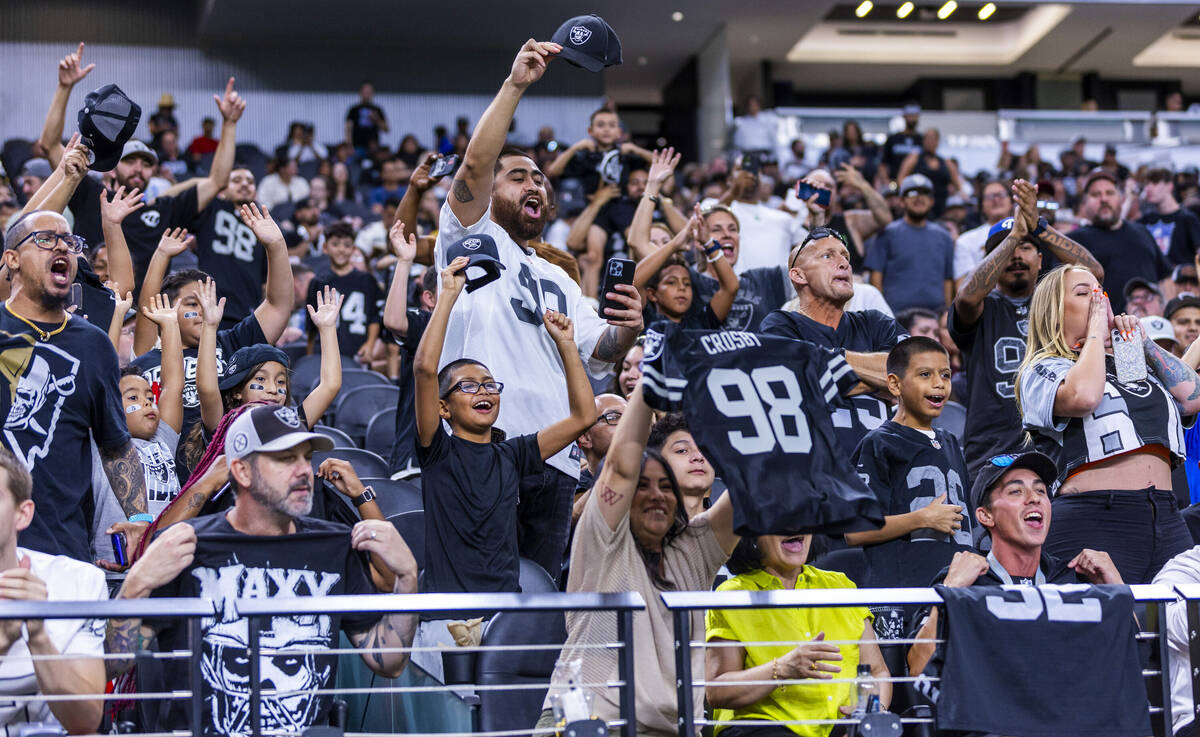 Raiders fans cheer for the team during an open practice at Allegiant Stadium on Tuesday, Aug. 2 ...