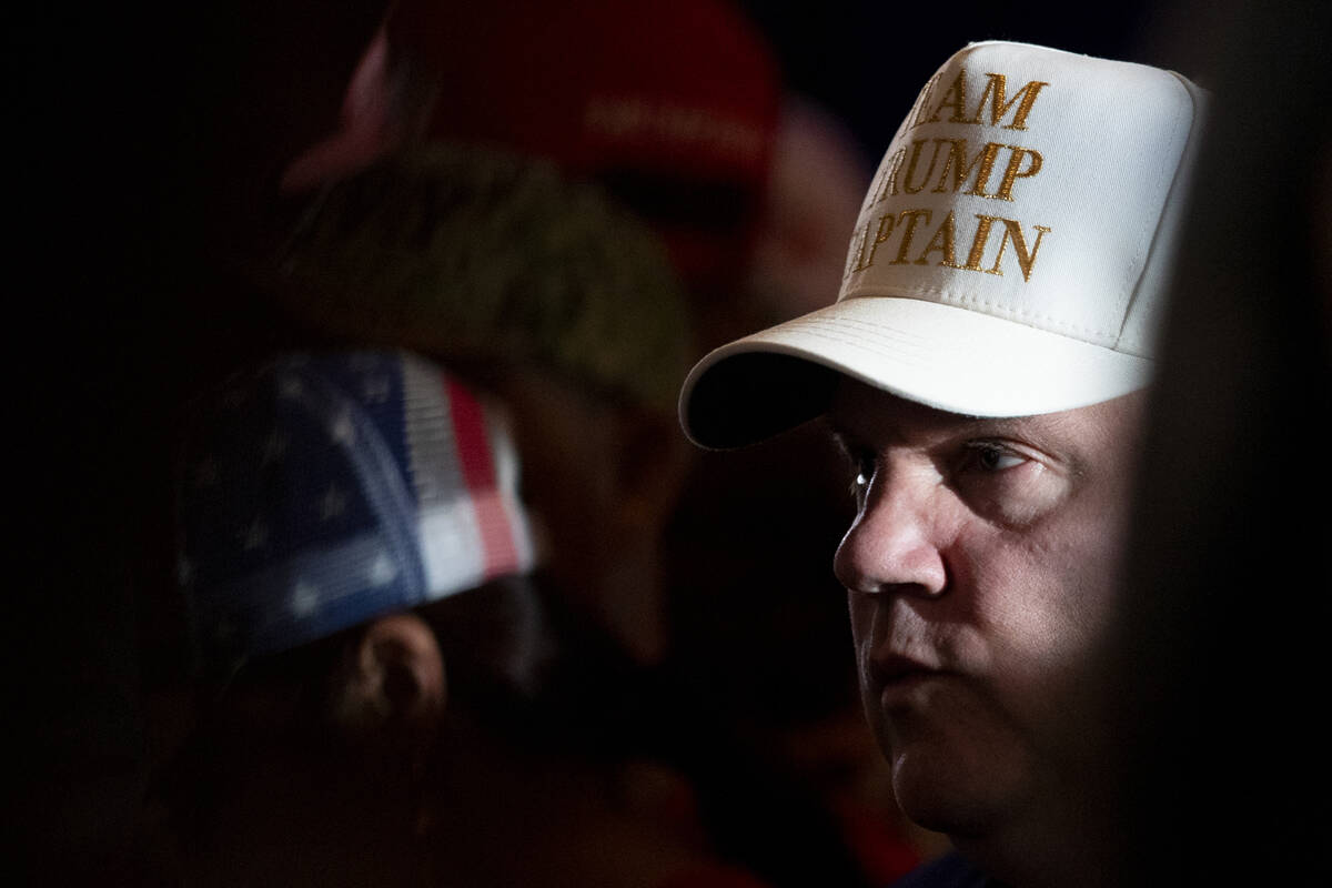 A supporter of Republican presidential nominee former President Donald Trump waits for the arri ...