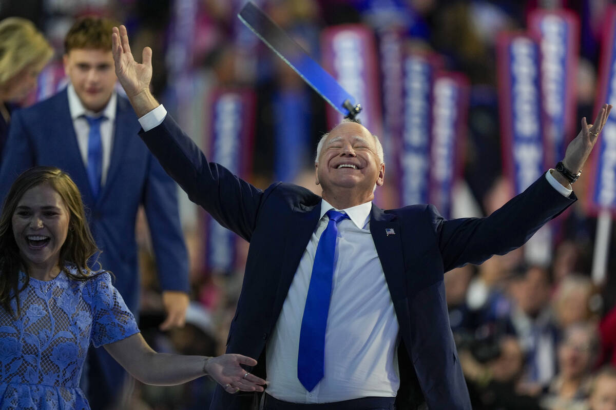 Democratic vice presidential nominee Minnesota Gov. Tim Walz reacts during the Democratic Natio ...