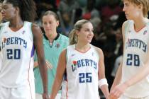 New York Liberty's Becky Hammon, second from right, smiles as teammates Shameka Christon, left ...