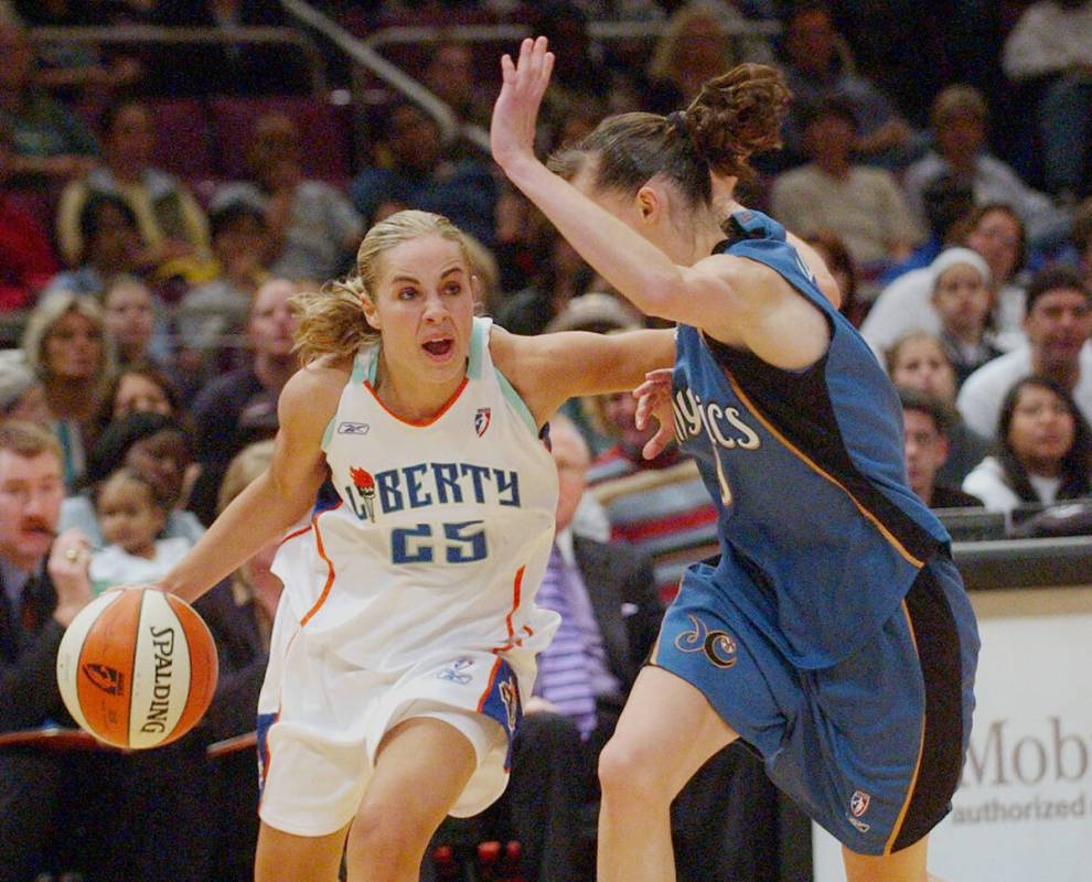 FILE - In this June 1, 2003 file photo, then-New York Liberty's Becky Hammon (25) drives agains ...