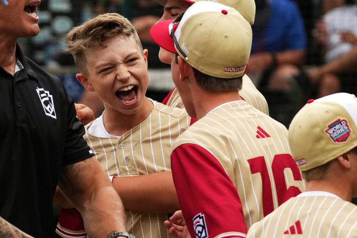 Henderson, Nev.'s Gunnar Gaudin, left, celebrates with teammates after getting the final out of ...