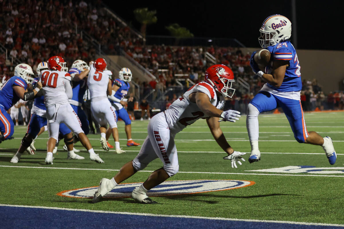 Bishop Gorman running back Myles Norman (24) catches the ball before scoring a touchdown while ...