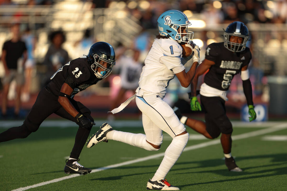 Centennial wide receiver Jayden "Jet" Thomas (1) runs up the field before scoring whi ...