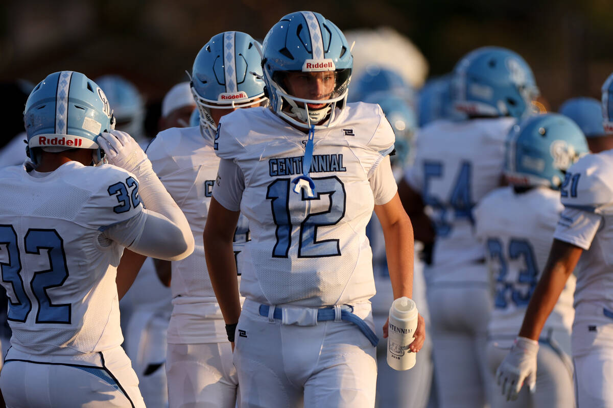 Centennial quarterback James Monaghan IV (12) paces the sideline during the first half of a hig ...