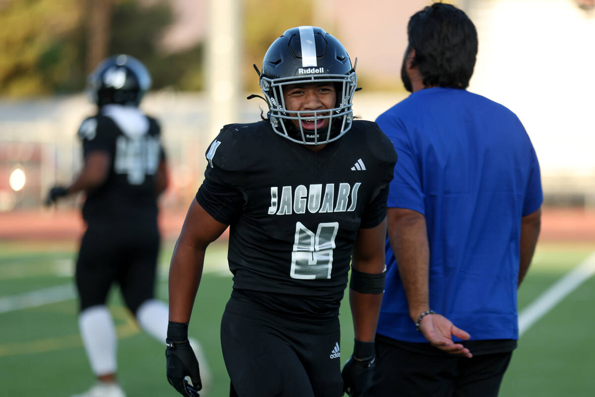 Desert Pines running back Isaiah Te'o (4) celebrates his touchdown during the first half of a h ...