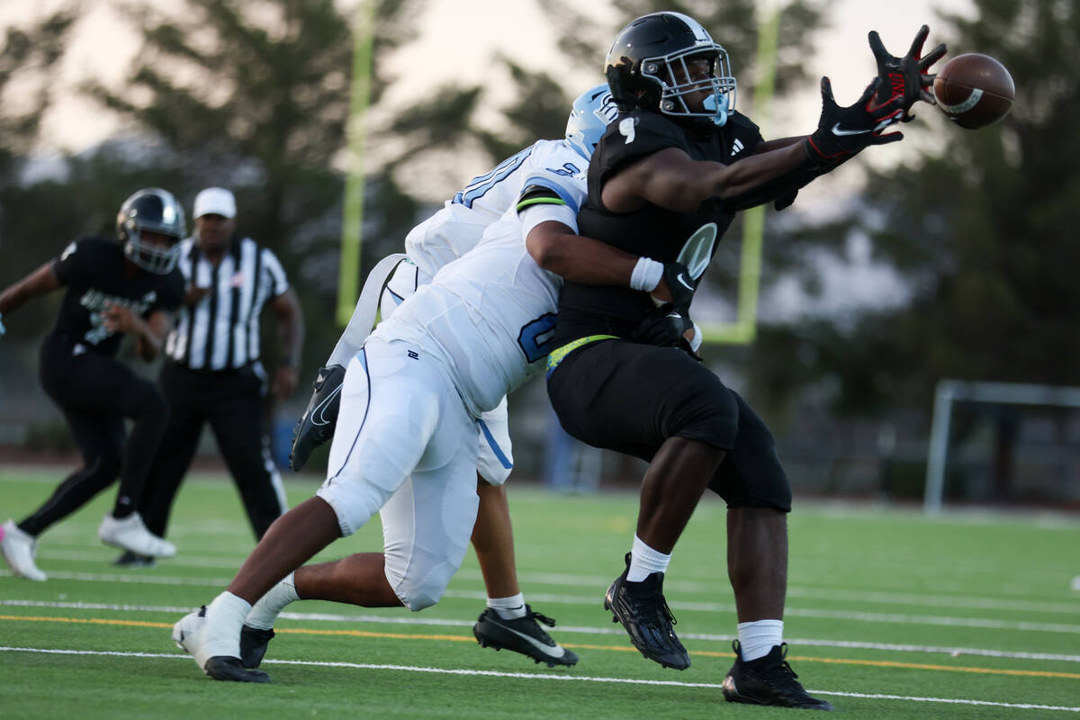 Centennial linebacker Jeremy Evans (8) thwarts a catch by Desert Pines tight end Michael Taylor ...