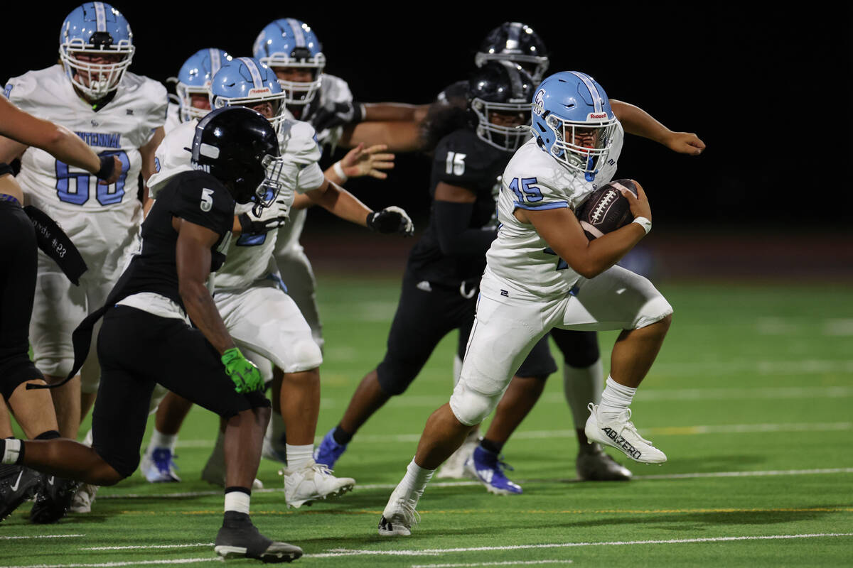 Centennial running back Kolten Silbernagel (45) rushes up the field while Desert Pines advances ...