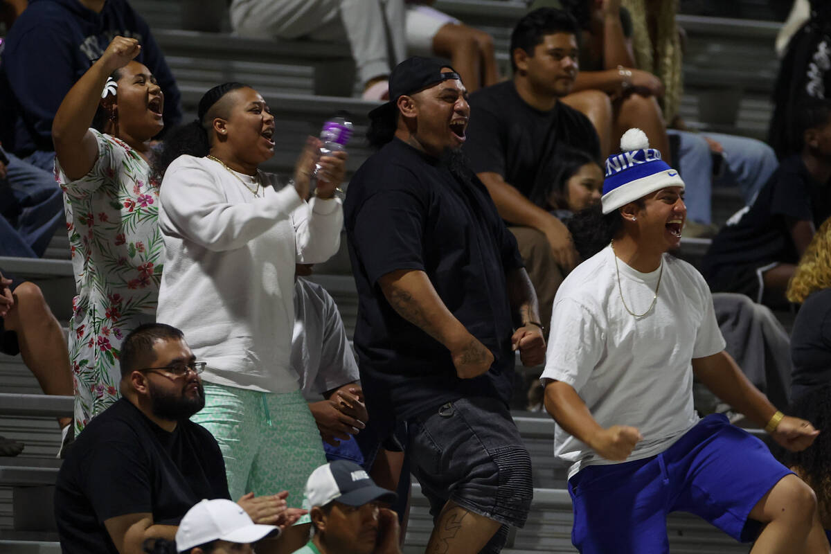 Desert Pines fans go wild for their team during the second half of a high school football game ...