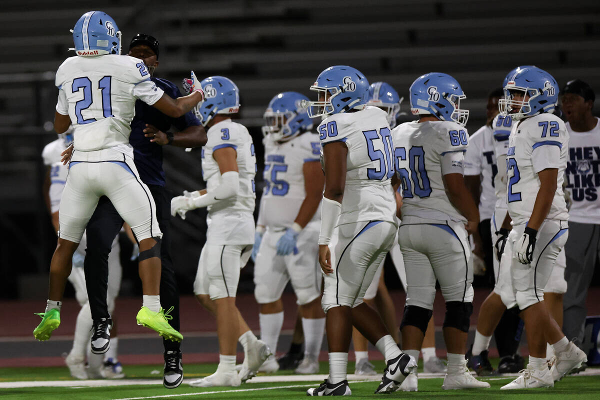 Centennial cornerback Dominique Vaughn (21) celebrates after catching an interception during th ...