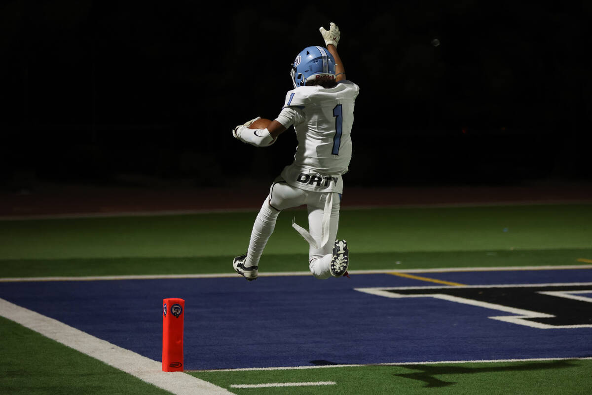 Centennial wide receiver Jayden "Jet" Thomas (1) leaps into the end zone during the s ...