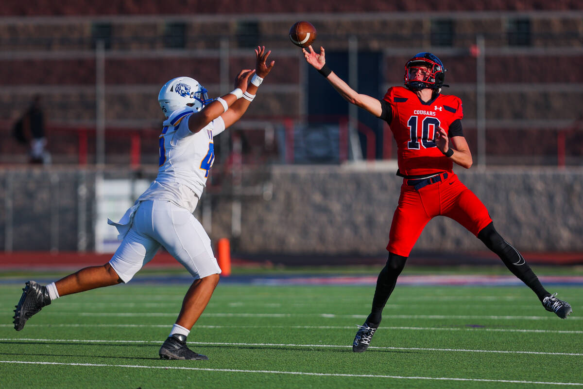 Sierra Vista defensive end Matai Olive (45) scurries to intercept a pass by Coronado quarterbac ...