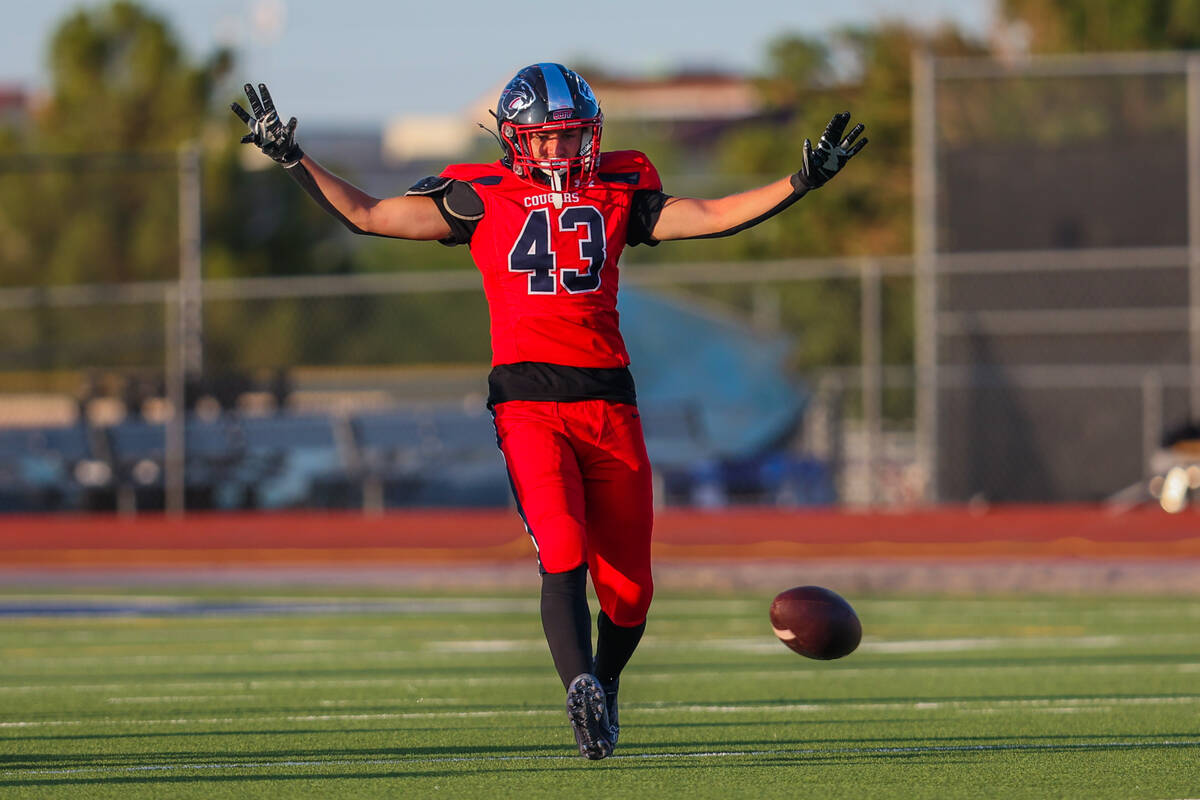 Coronado linebacker William Bittman (43) puts his hands up as the ball lands during a returning ...