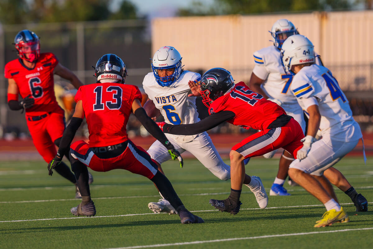 Sierra Vista running back Gordon Austin (6) moves the ball through Coronado defenders during a ...