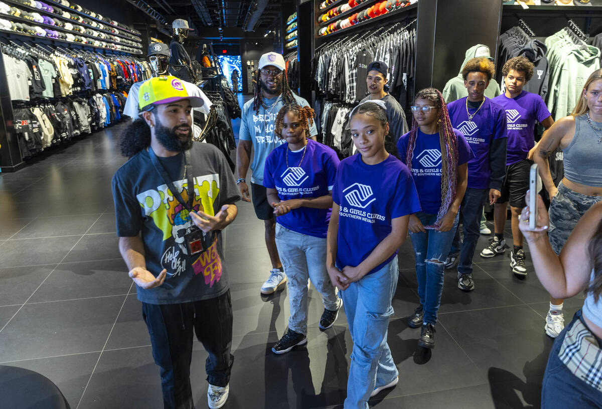 Tour guide Gio Peralte, left, shows teens from the Boys & Girls Clubs of Southern Nevada an ...