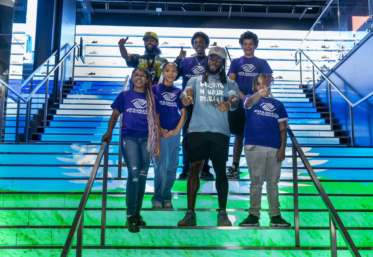 Raiders running back Alexander Mattison, center, hangs with teens from the Boys & Girls Clu ...