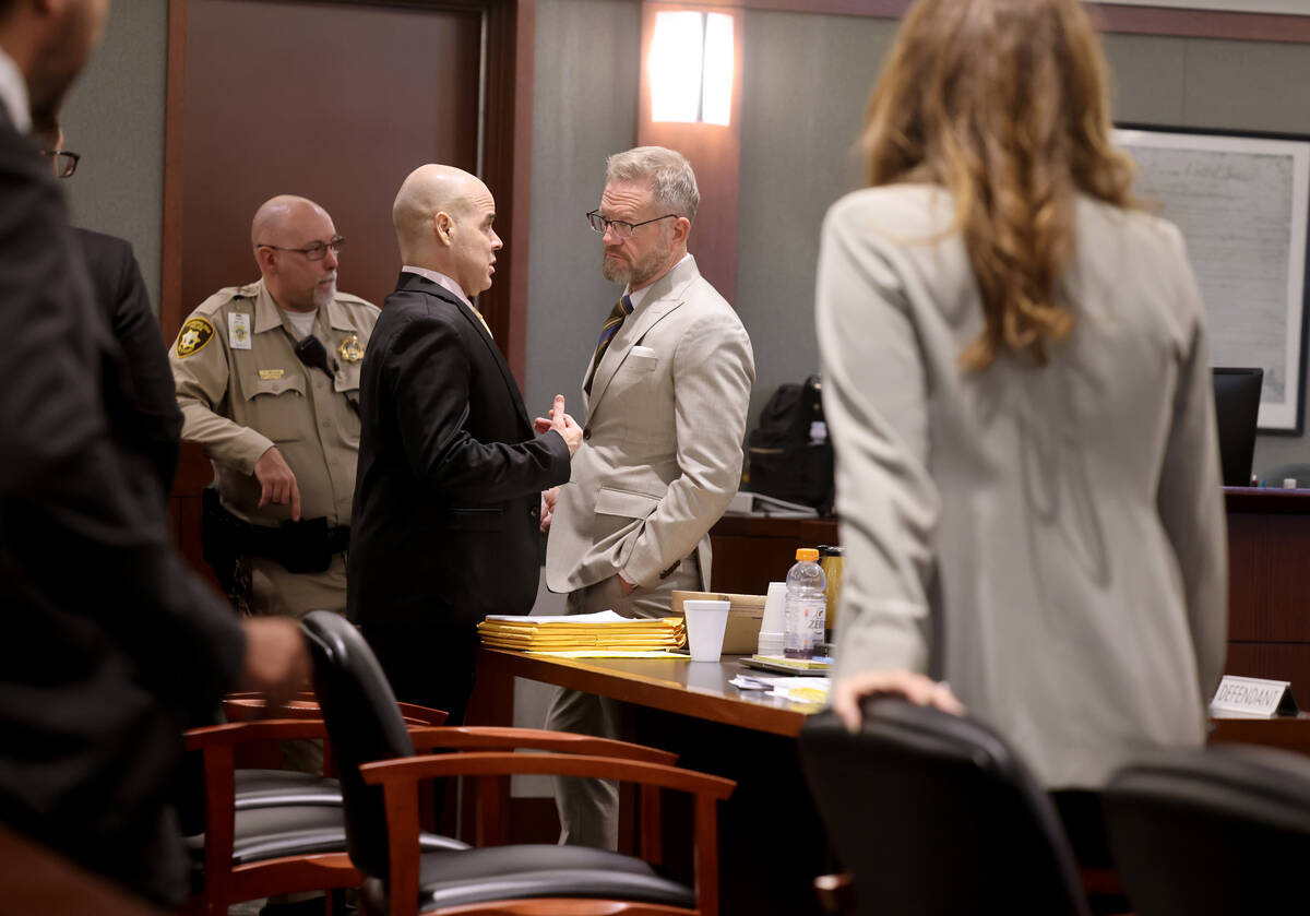 Robert Telles, left, talks to one of his attorneys Robert Draskovich during a break on the 10th ...