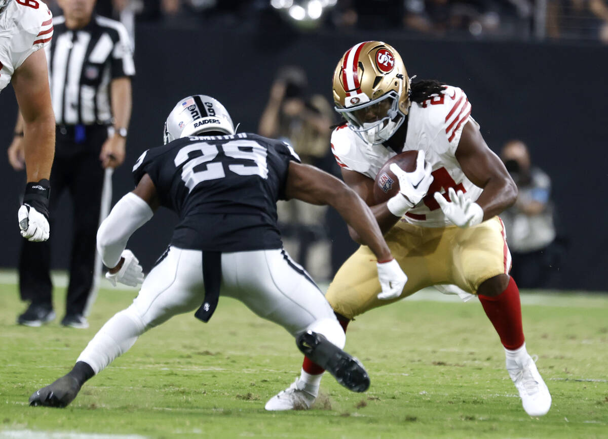 Raiders safety Chris Smith II (29) misses a tackle against San Francisco 49ers running back Jor ...