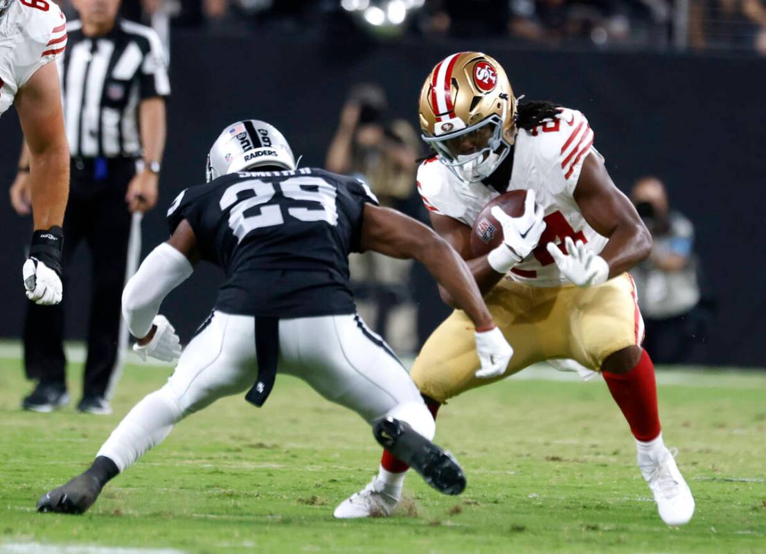 Raiders safety Chris Smith II (29) misses a tackle against San Francisco 49ers running back Jor ...