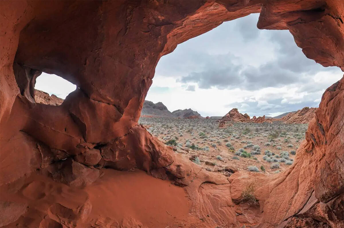 Jutting rocks and natural caves that have been carved out by erosion and weathering along Redst ...